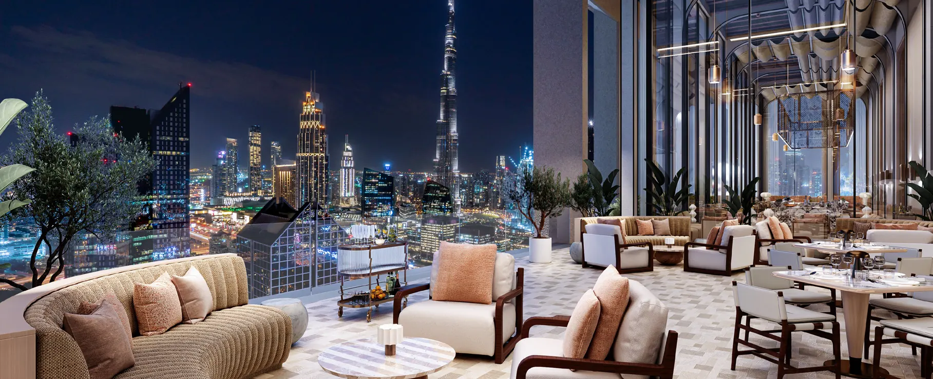 Rooftop lounge at AHS Twin Towers overlooking Burj Khalifa at night